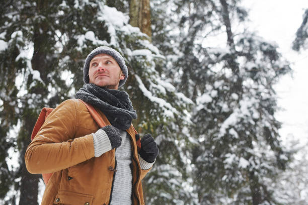 istock Serious backpacker hiking in winter forest 1057945648