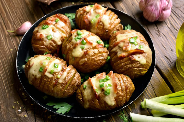 istock Baked potatoes with bacon, green onion and cheese 1057949624
