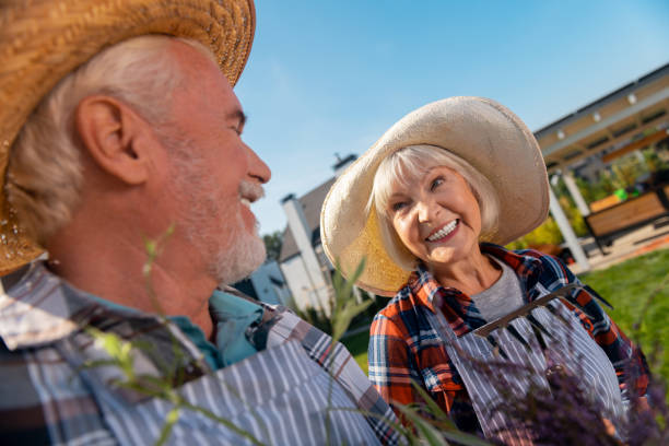istock Pleasant nice man and woman looking at each other 1057949662