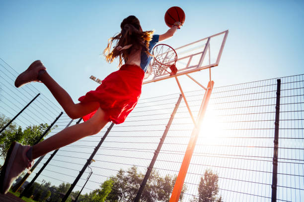 istock Enigmatical girl jumping high during active game 1057950200