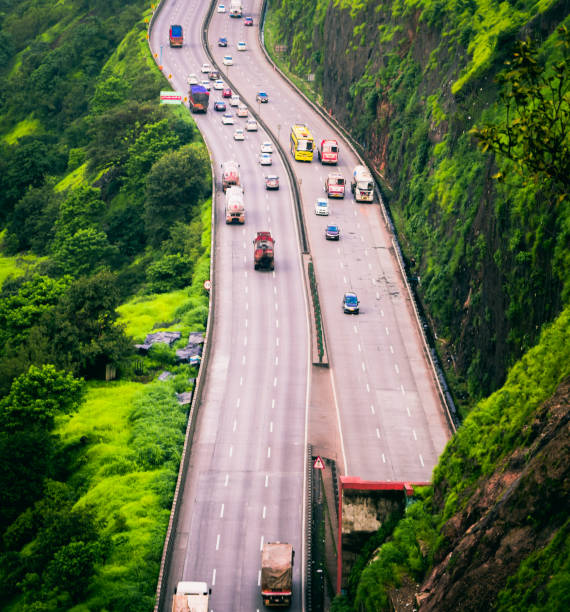 Picture of the Mumbai-Pune expressway. The Mumbai-Pune expressway is one of the busiest national highway of India. It takes three hours for the complete journey. pune photos stock pictures, royalty-free photos & images