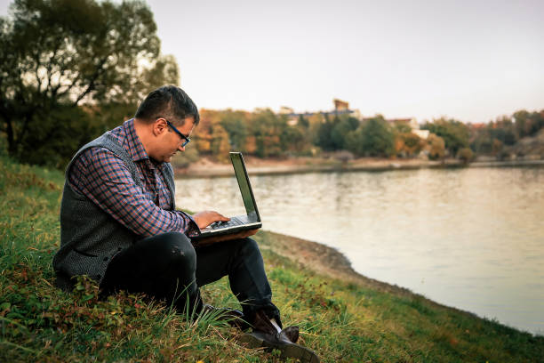 istock Millenials working - Businessman checking accounting documentation in online database on modern computer connecting to wireless internet connection 1057953216