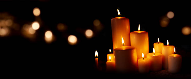 Candle lights and bokeh in the night Candle lights and festive golden bokeh in the christmas night religious service photos stock pictures, royalty-free photos & images
