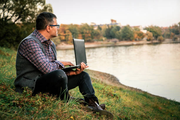 istock Millenials working - Businessman checking accounting documentation in online database on modern computer connecting to wireless internet connection 1057953654