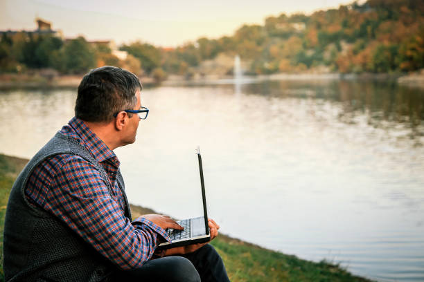 istock Millenials working - Businessman checking accounting documentation in online database on modern computer connecting to wireless internet connection 1057954106