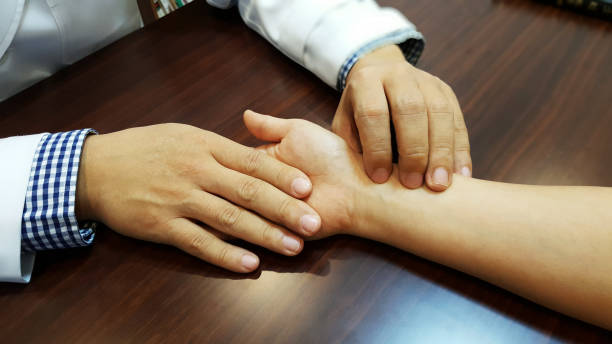 oriental medicine The doctor feels the pulse for diagnosis of patient.
be treated with Chinese medicine, oriental medicine. acupuncture model stock pictures, royalty-free photos & images