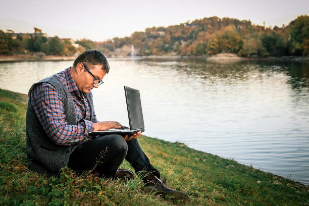 istock Millenials working - Businessman checking accounting documentation in online database on modern computer connecting to wireless internet connection 1057956248