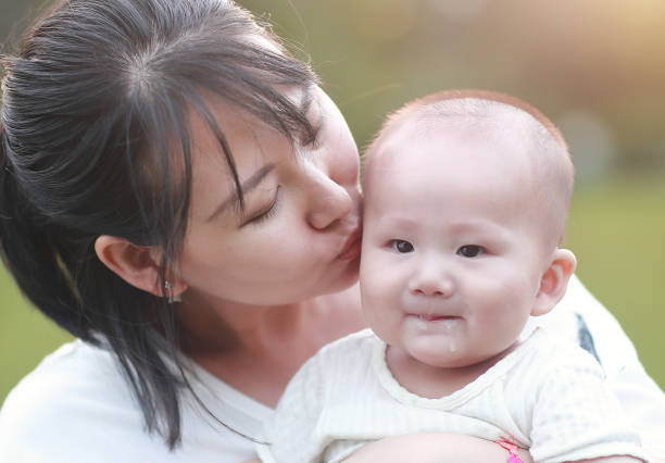istock Happy Asian mother and son in sunlight 1057959548