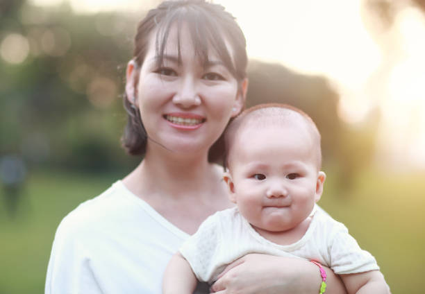 istock Happy Asian mother and son in sunlight 1057961716