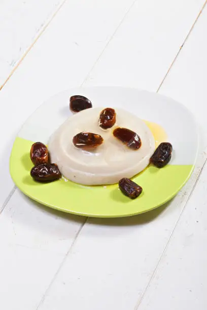Date fruit jelly dessert with honey. Vertical shot