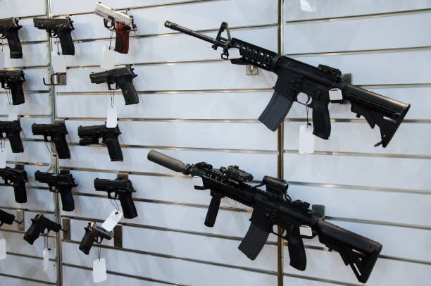 istock Gun wall rack with rifles and pistol. 1057963324