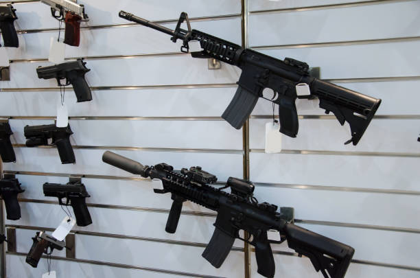 istock Gun wall rack with rifles and pistol. 1057963346