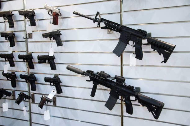 istock Gun wall rack with rifles and pistol. 1057963460