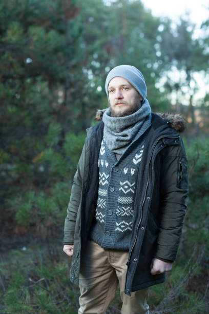 istock Portrait brutal bearded hipster man in the forest 1057968142