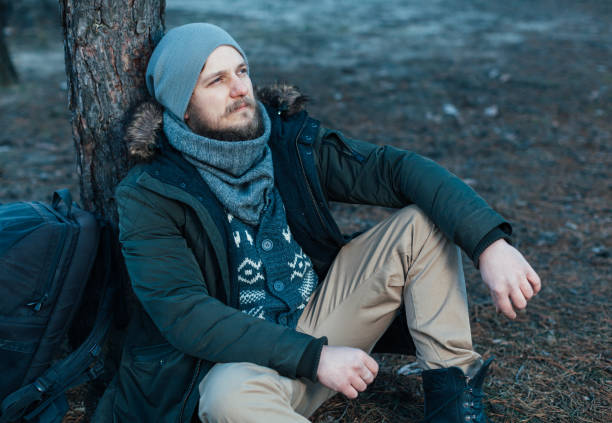 istock Pensive hipster guy wanderlust with touristic backpack enjoy tranquility during exploring nature environment, male hiker thinking about route to discover 1057968222