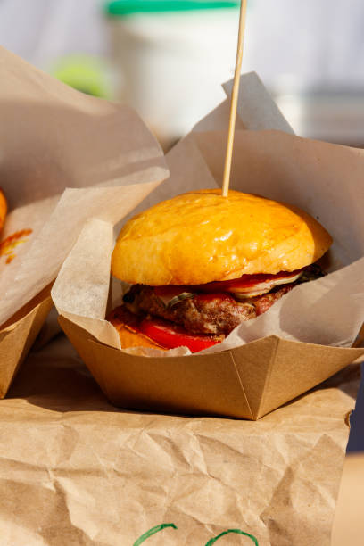 istock Delicious big hamburger packed in cardboard box 1057971722