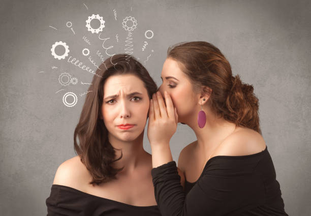 istock girl telling secret things to her girlfriend 1057971828