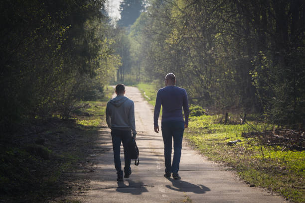 istock Two friends on walk, big and small concept 1057974672