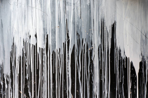 drips of white paint on black wall. - paint stroke wall textured imagens e fotografias de stock