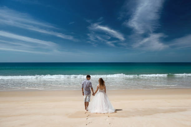 Wedding couple at idyllic sea beach