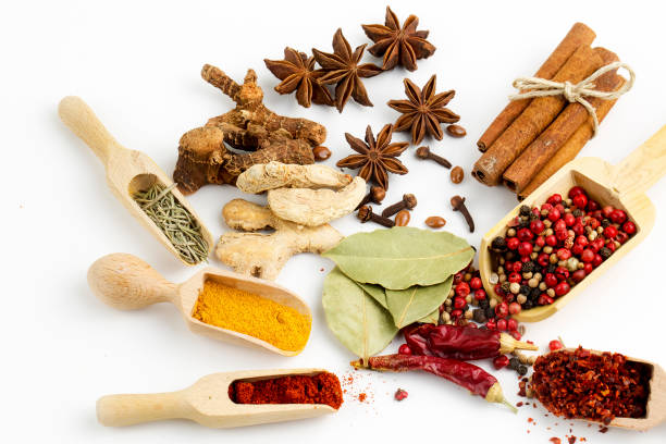 istock Top view mix spices and herbs different size terracotta pots on white background with copy space for design vegetables, healthy lifestyle, spices, herbs or foods content. 1057981140