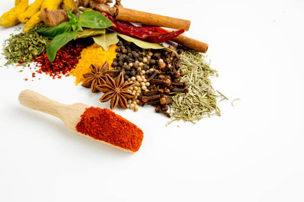 istock Top view mix spices and herbs different size terracotta pots on white background with copy space for design vegetables, healthy lifestyle, spices, herbs or foods content. 1057981220