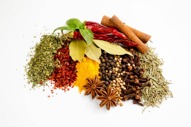 istock Top view mix spices and herbs different size terracotta pots on white background with copy space for design vegetables, healthy lifestyle, spices, herbs or foods content. 1057981236