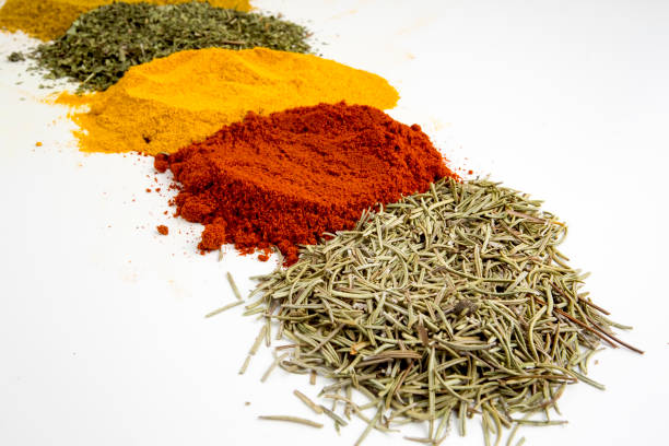 Top view mix spices and herbs different size terracotta pots on white background with copy space for design vegetables, healthy lifestyle, spices, herbs or foods content.