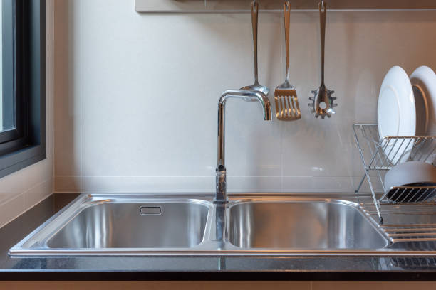istock sink with faucet in kitchen 1057981344