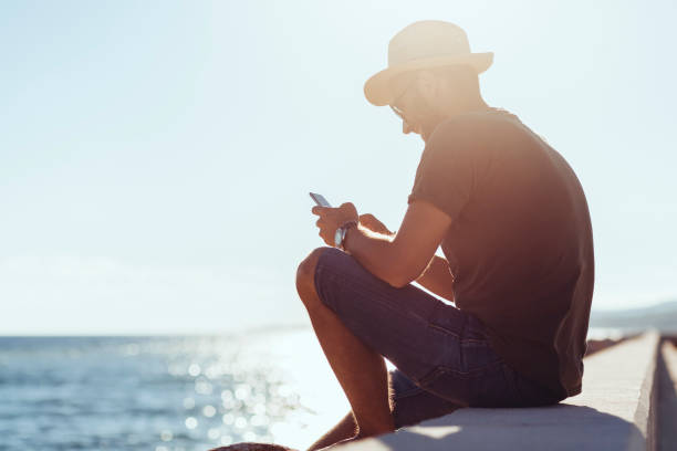 istock Man enjoying the view in the harbor 1057982188