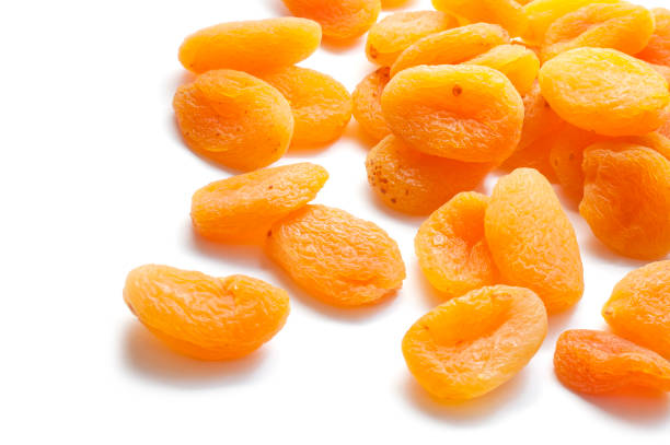 istock Dried apricots isolated on white background 1057984420