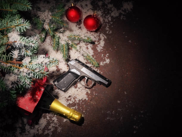 istock Pistol and Christmas balls on rustic metal background 1057986268