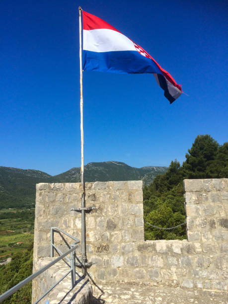 istock the croatian flag at an old tower 1057994514