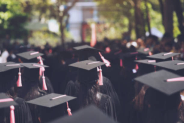istock backside graduation hats during commencement success graduates of the university, Concept education congratulation. Graduation Ceremony ,Congratulated the graduates in University during commencement. 1058002178