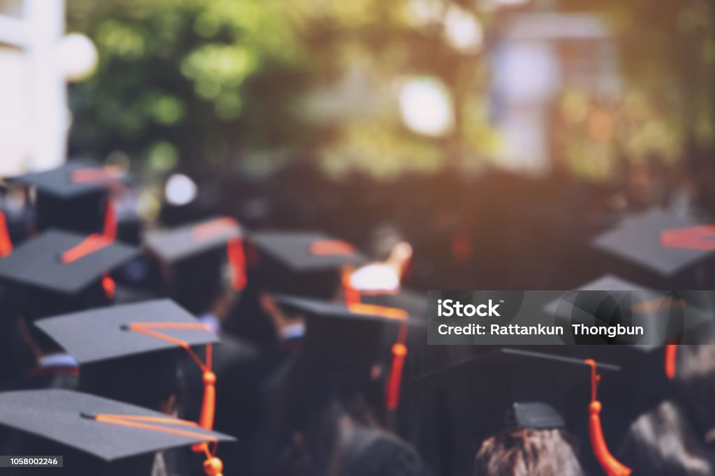 backside graduation hats during commencement success graduates of the university, Concept education congratulation. Graduation Ceremony ,Congratulated the graduates in University during commencement. Graduation Stock Photo