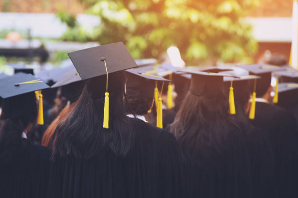 istock backside graduation hats during commencement success graduates of the university, Concept education congratulation. Graduation Ceremony ,Congratulated the graduates in University during commencement. 1058003018