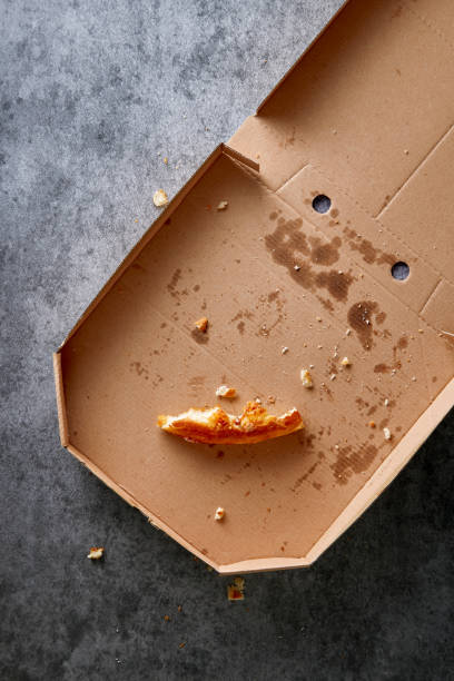 Pizza box with leftowers. Empty pizza cardboard box viewed from above. Top view.