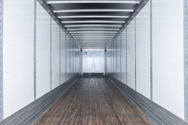 Interior view of empty semi truck dry van commercial trailer stock photo