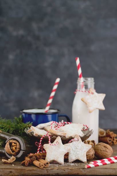 istock Christmas cookies with nuts and milk at holiday table. Composition concept with free copy space for text. 1058010254