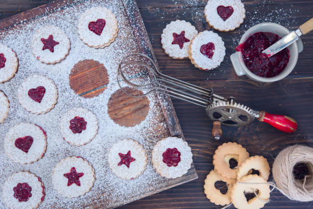istock Linzer Christmas cookies with jam and powder sugar flat lay and copy space. Creative concept. 1058010488