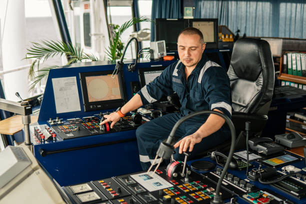 istock Marine navigational officer is maneuvering ship or vessel 1058010964