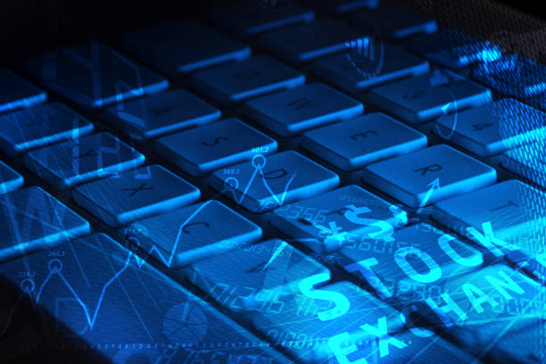 istock Keyboard with glowing business icons 1058011286