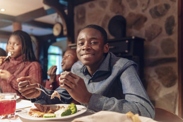istock African-American during thanksgiving dinner 1058013644