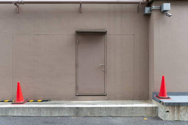 istock sidewalk by street wall & door 1058014528
