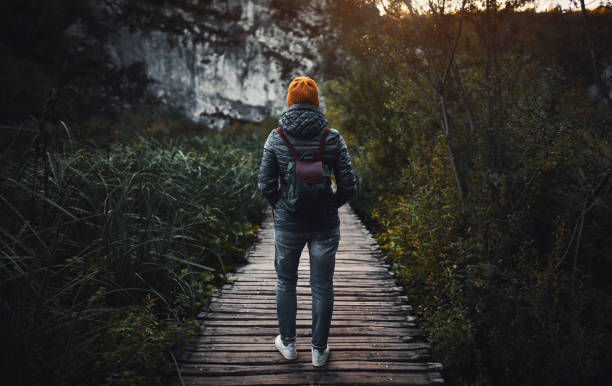 istock Tourist exploring Plitvice Lakes National Park 1058025906
