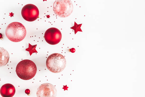 istock Christmas composition. Christmas red and pink decorations on white background. Flat lay, top view, copy space 1058026074