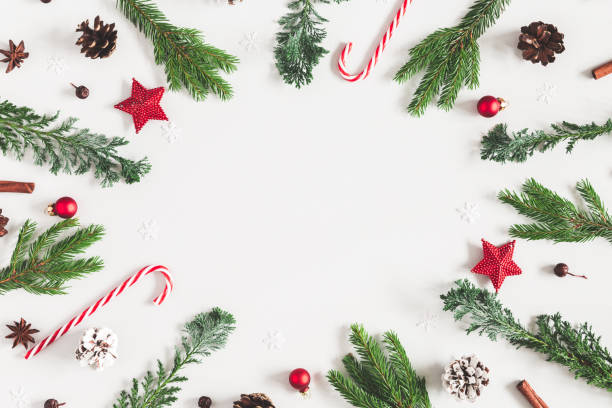 istock Christmas composition. Christmas decorations, fir tree branches,. pine cones on pastel gray background. Flat lay, top view, copy space 1058026364