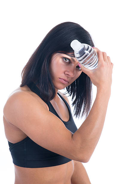 Female athlete with water bottle stock photo