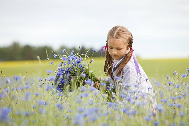 istock Little girl picking flowers 105802735