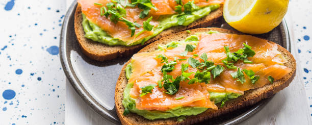 istock Rye bread avocado toasts with smoked salmon 1058027526